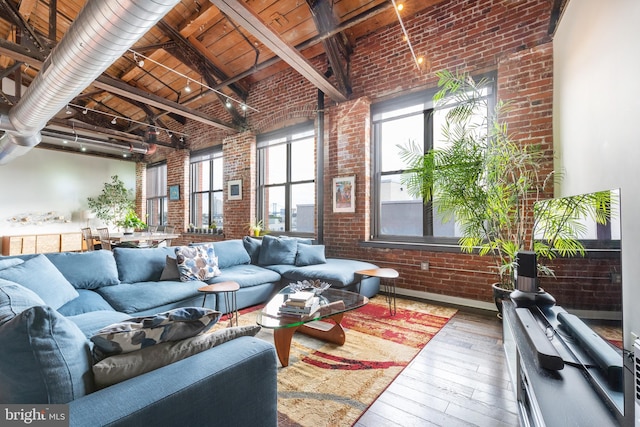 interior space featuring lofted ceiling with beams and wooden ceiling