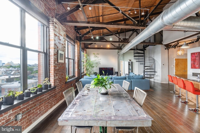 dining room featuring wood ceiling, brick wall, beam ceiling, high vaulted ceiling, and dark hardwood / wood-style floors