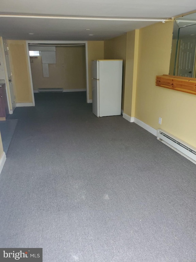 basement featuring white fridge