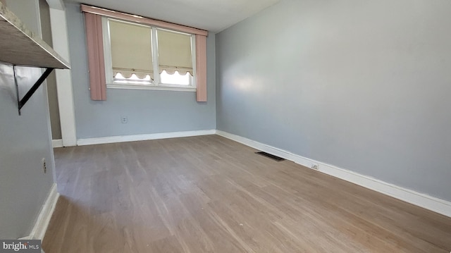 empty room with light wood-type flooring