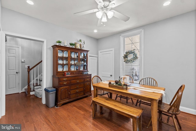 dining space featuring ceiling fan and dark hardwood / wood-style flooring