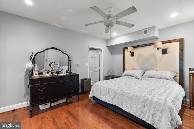 bedroom with ceiling fan and dark hardwood / wood-style floors