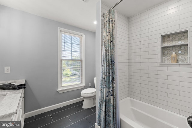 full bathroom featuring tile patterned flooring, vanity, shower / tub combo, and toilet