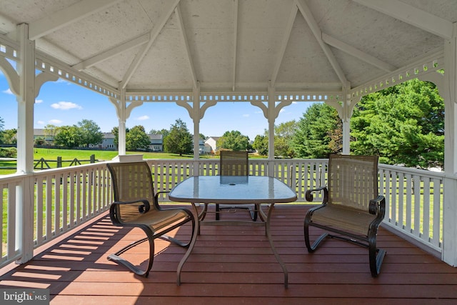 deck with a gazebo and a lawn