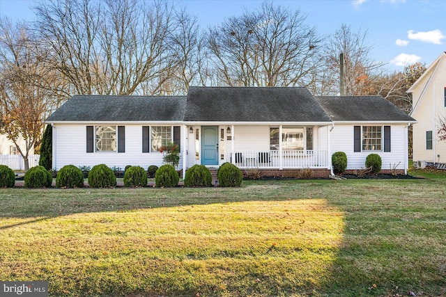 ranch-style house with a front lawn and a porch