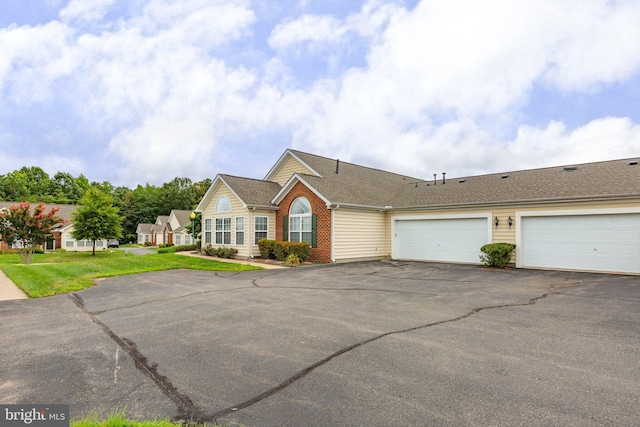 single story home featuring a garage