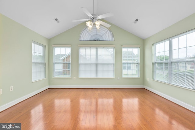 unfurnished sunroom with ceiling fan and vaulted ceiling