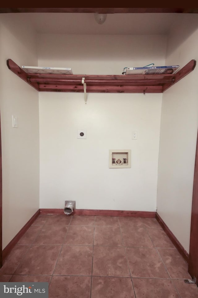 clothes washing area with washer hookup, electric dryer hookup, and tile patterned floors