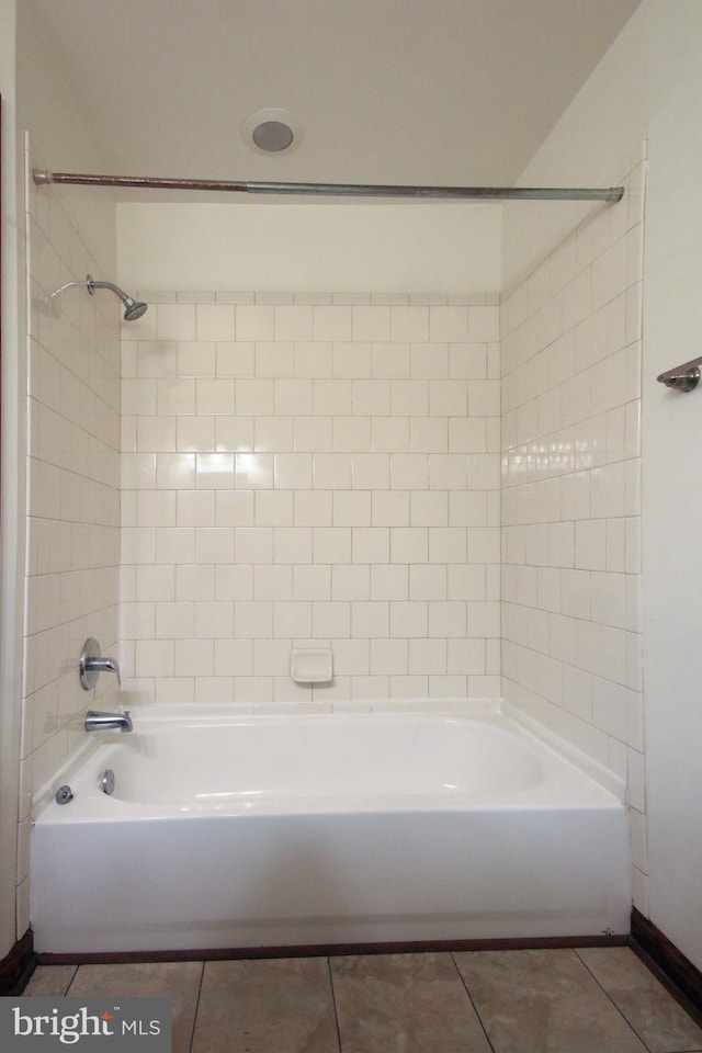 bathroom featuring tile patterned floors and tiled shower / bath combo