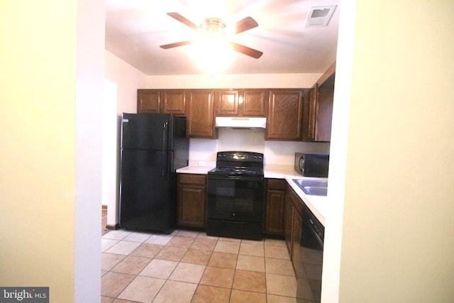 kitchen with black appliances, ceiling fan, light tile patterned floors, and sink