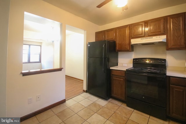 kitchen featuring black appliances, ceiling fan, and light tile patterned floors