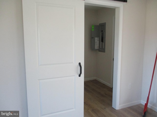 hall with electric panel and dark hardwood / wood-style floors