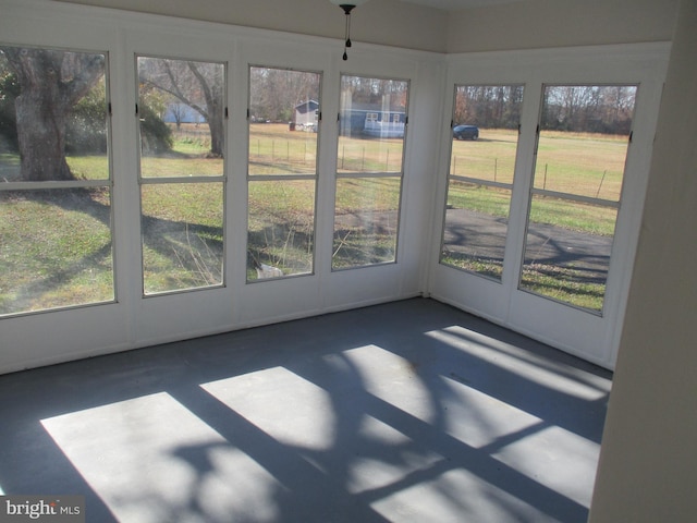 unfurnished sunroom with a healthy amount of sunlight