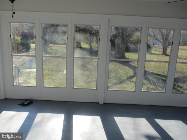 unfurnished sunroom with plenty of natural light