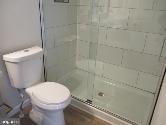 22403 Marsh Creek Rd, Preston, MD 21655 - full bathroom with a tile shower, toilet, and wood finished floors