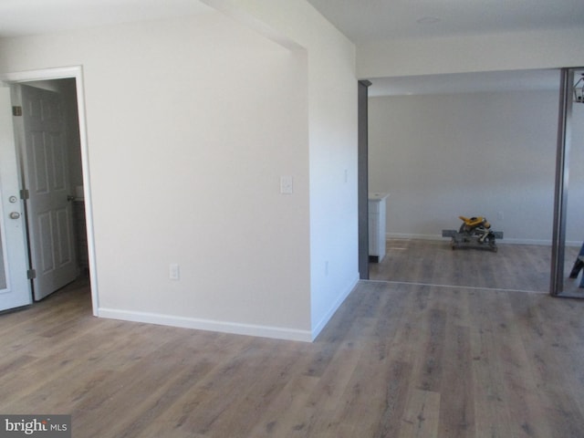 hallway featuring dark hardwood / wood-style flooring