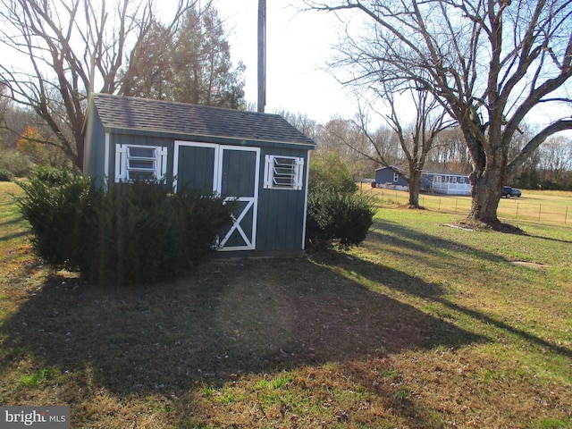 view of outbuilding with a lawn