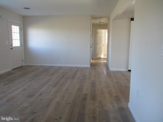 spare room featuring wood-type flooring