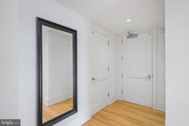 corridor featuring hardwood / wood-style flooring