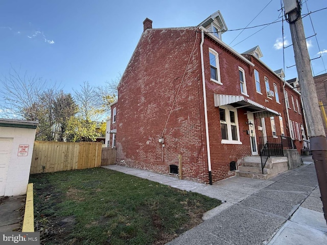 view of property exterior with a yard