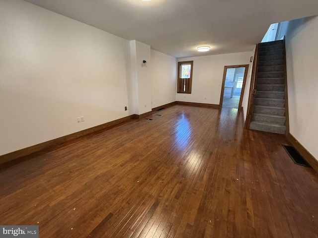 unfurnished room with dark hardwood / wood-style floors