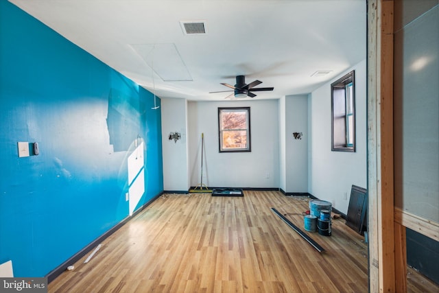 interior space with ceiling fan and light hardwood / wood-style floors