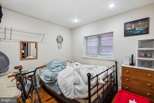 bedroom featuring dark wood-type flooring