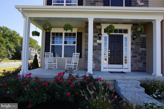 property entrance with covered porch