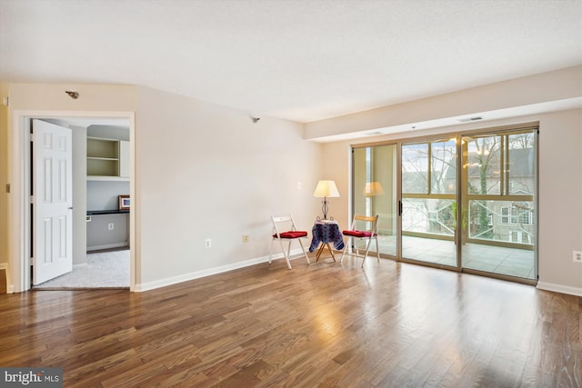 empty room with hardwood / wood-style floors