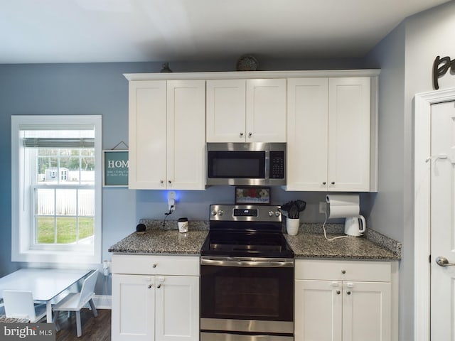 kitchen featuring white cabinets and appliances with stainless steel finishes