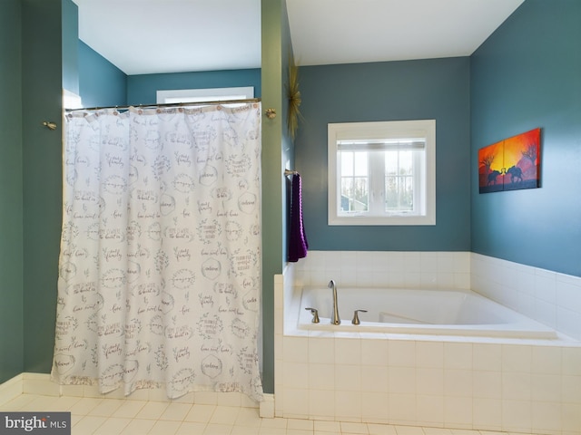 bathroom with tile patterned floors and separate shower and tub