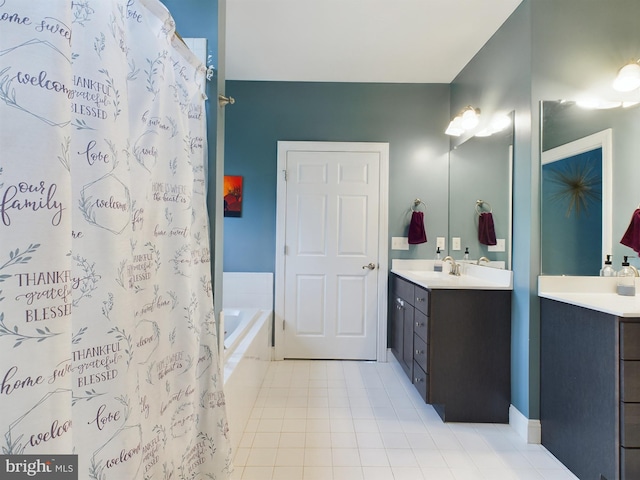 bathroom with tile patterned floors, vanity, and shower with separate bathtub