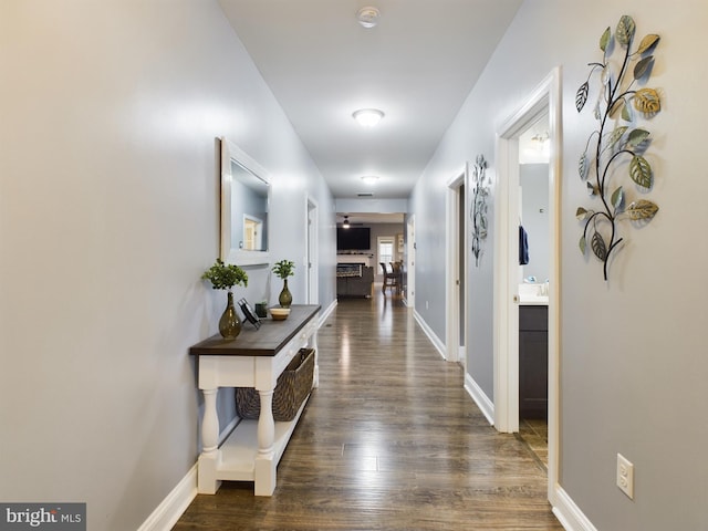 hall with dark hardwood / wood-style flooring