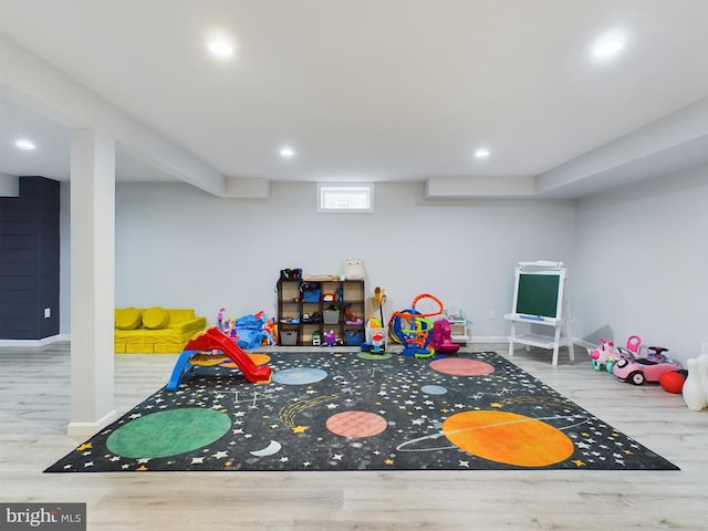 playroom with light hardwood / wood-style flooring