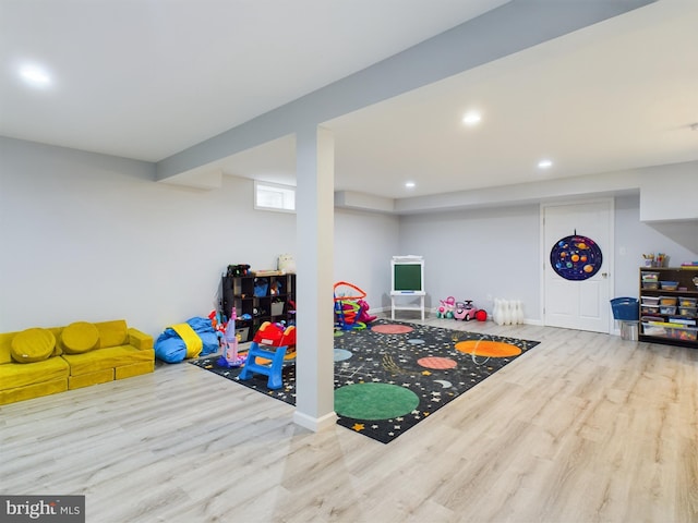 rec room with light wood-type flooring