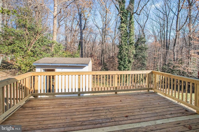 wooden terrace featuring an outbuilding