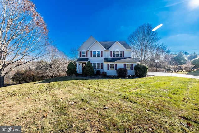 front facade with a front lawn