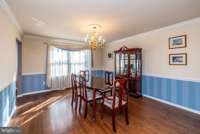 dining room featuring a chandelier, crown molding, and dark wood-type flooring