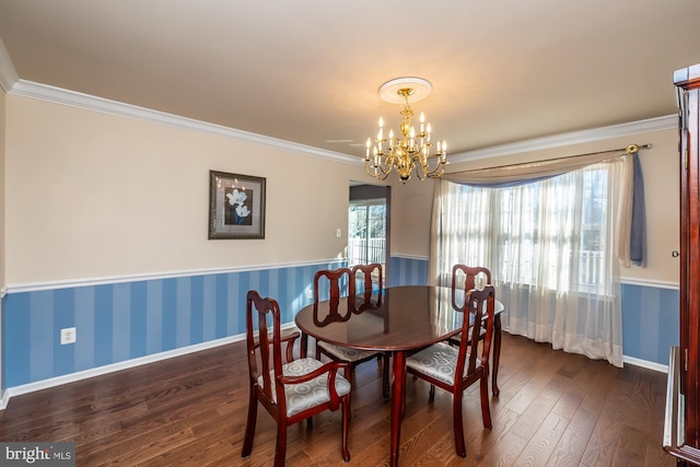 dining space with a chandelier, dark wood-type flooring, and ornamental molding