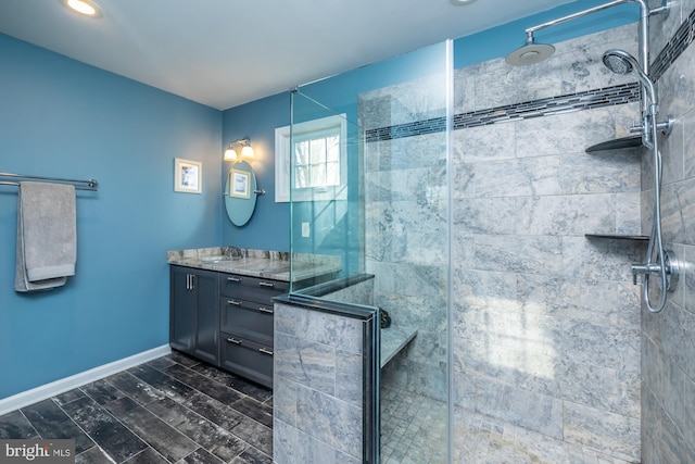 bathroom featuring vanity and a shower with shower door