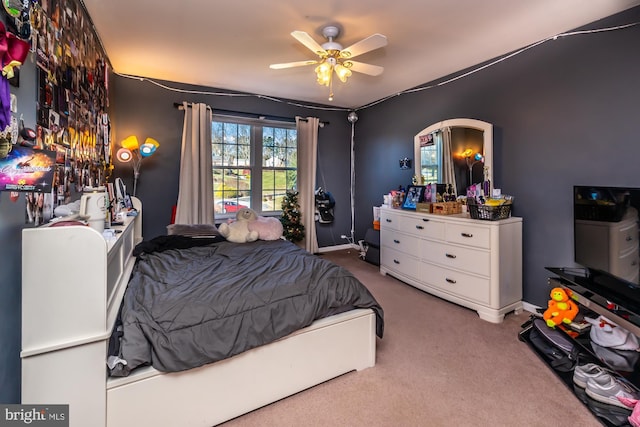 bedroom featuring ceiling fan and carpet