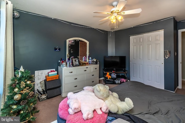 bedroom featuring carpet, ceiling fan, and a closet