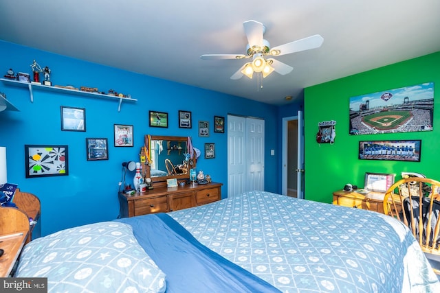 bedroom with ceiling fan and a closet