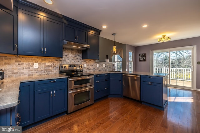 kitchen featuring kitchen peninsula, stainless steel appliances, and dark hardwood / wood-style floors