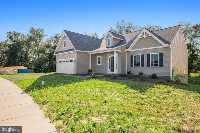 view of front facade featuring a front yard and a garage