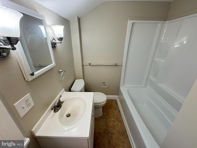 bathroom with a bathing tub, tile patterned flooring, vanity, and toilet