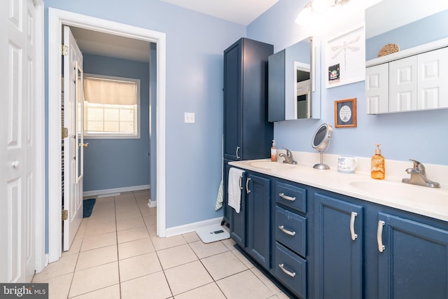 bathroom with tile patterned flooring and vanity