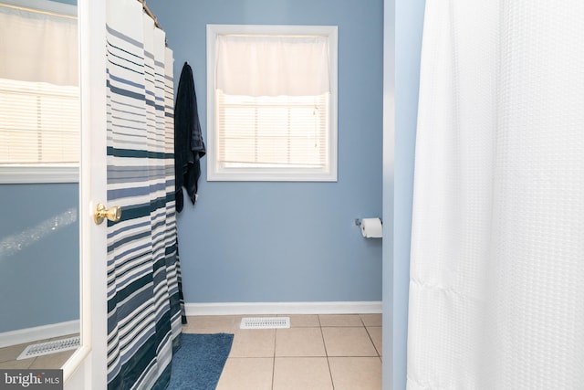 bathroom with tile patterned flooring