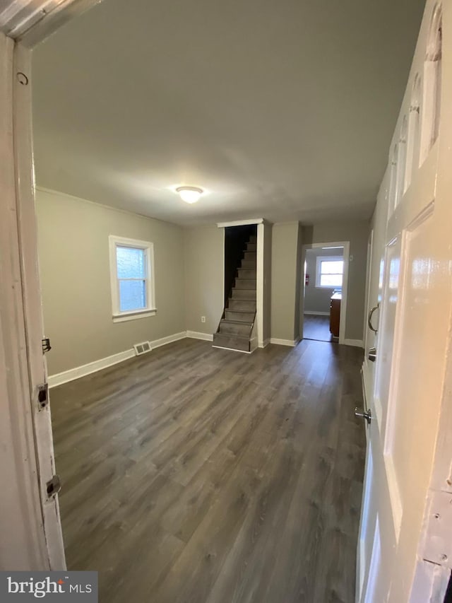 interior space with dark hardwood / wood-style flooring