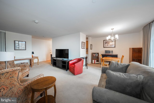 living room featuring a notable chandelier and light colored carpet